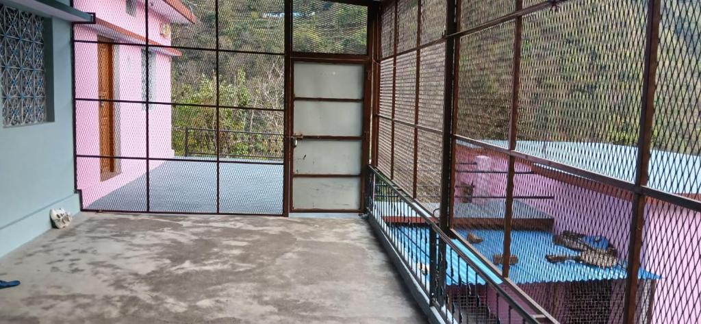 a large cage with birds inside of it at Sandeep Homes in Tehri-Garhwāl