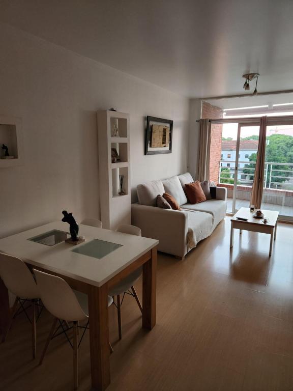 a living room with a couch and a table at Dpto Nuñez in Buenos Aires