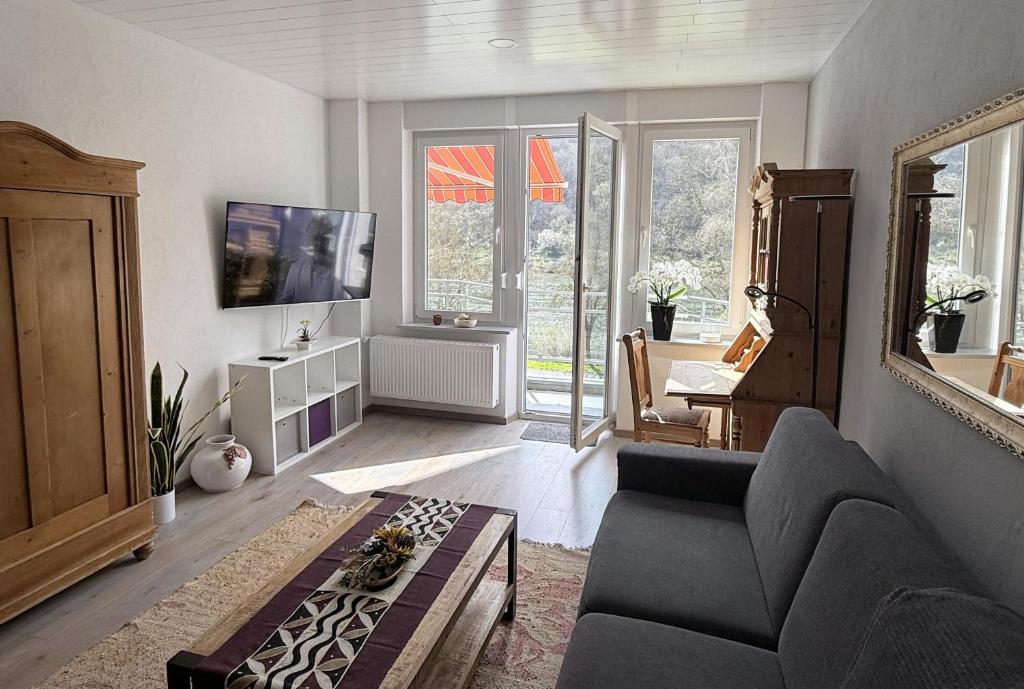 a living room with a couch and a table at Schöne Aussicht in Ediger-Eller