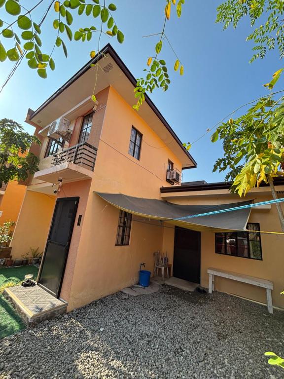 a house with a large driveway in front of it at Amalia Homes Staycation in Palo