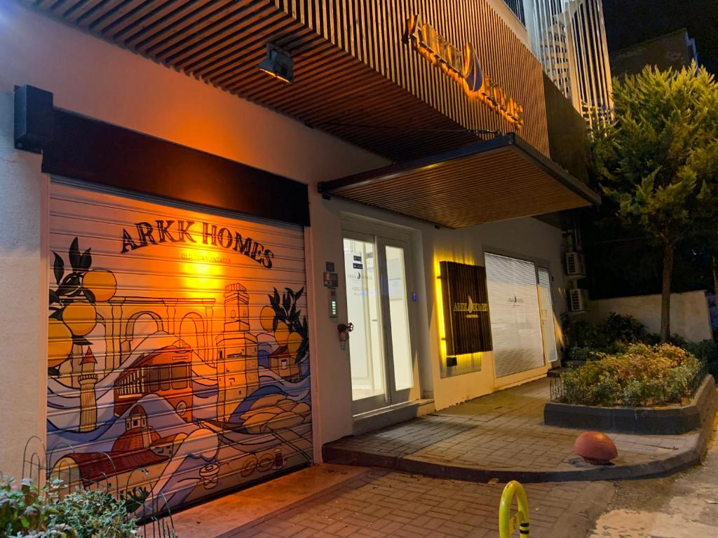 a building with a painting on the side of it at Arkk Homes in Antalya