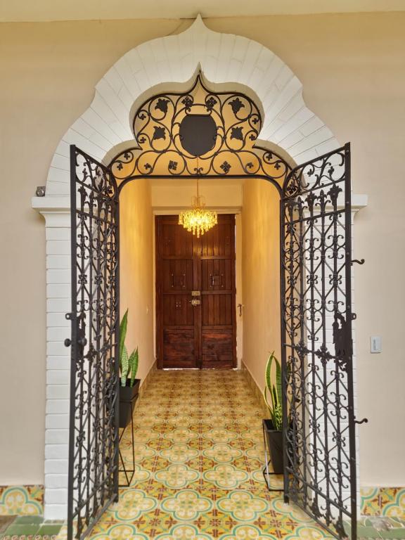 an entrance to a house with a wrought iron gate at Hotel Casa Dharma in Popayan