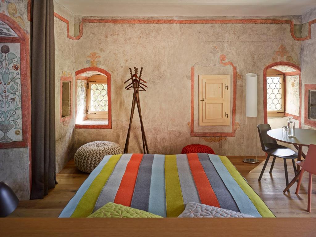 Postel nebo postele na pokoji v ubytování Boutique Hotel Schlossberg