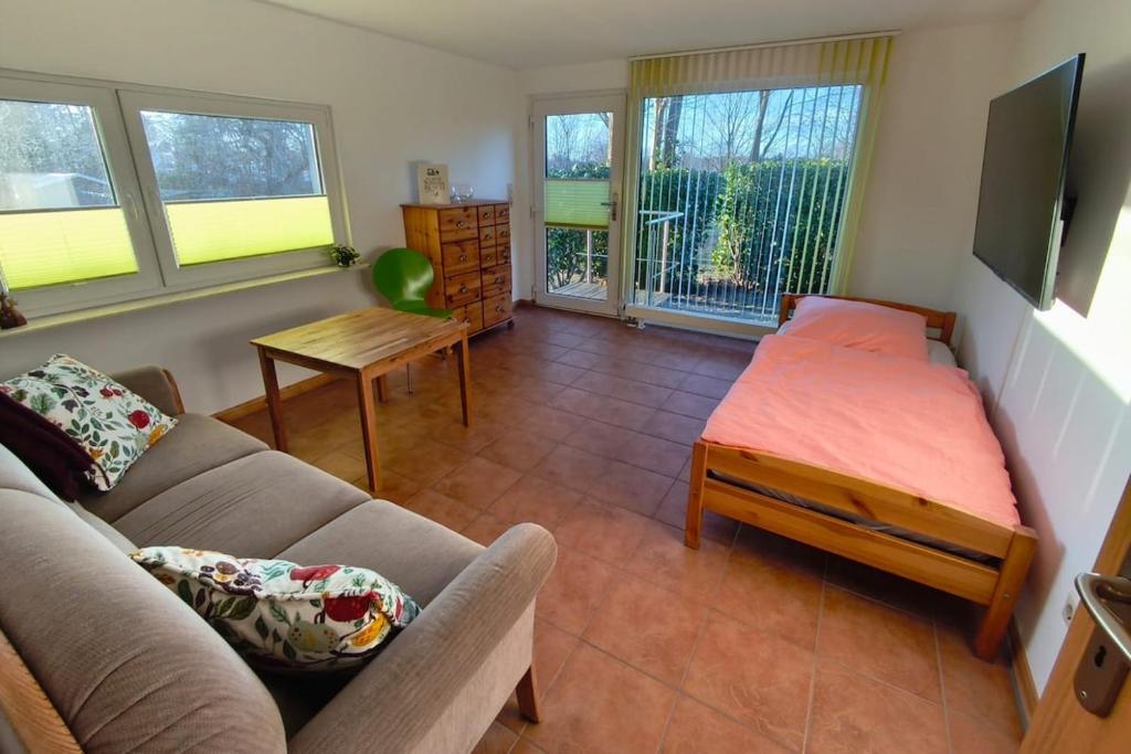 a living room with a couch and a table at A short break on Germany's largest island in Garz