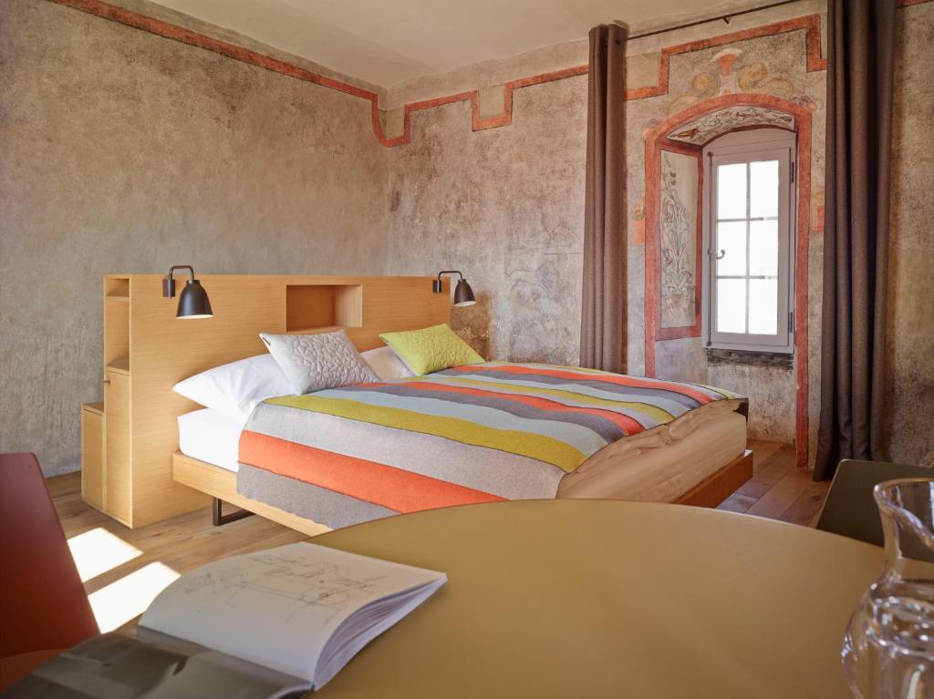 Postel nebo postele na pokoji v ubytování Boutique Hotel Schlossberg