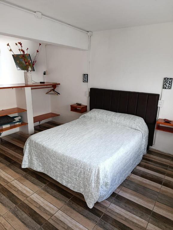 a bedroom with a large bed in a room at La soñada 1 in Villa Mercedes