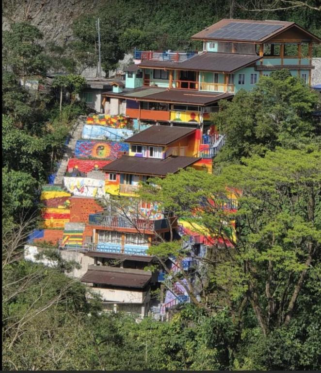 a house with a painting on the side of a hill at Cliffhouse Kalinga in Tinglayan