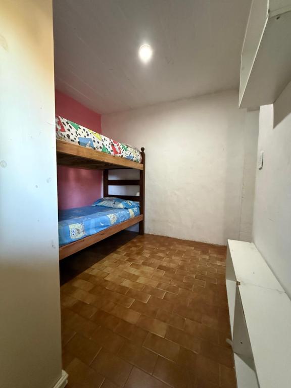 a small room with two bunk beds in it at Lo de Nery in Ostende