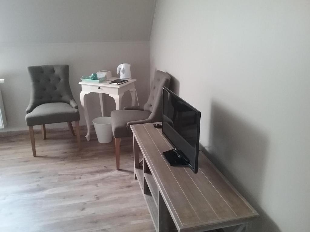 TV a/nebo společenská místnost v ubytování B&B De Dulle Koe
