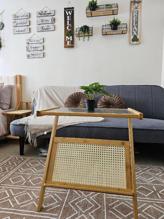 a living room with a couch and a table at BE Residences Lahug in Cebu City