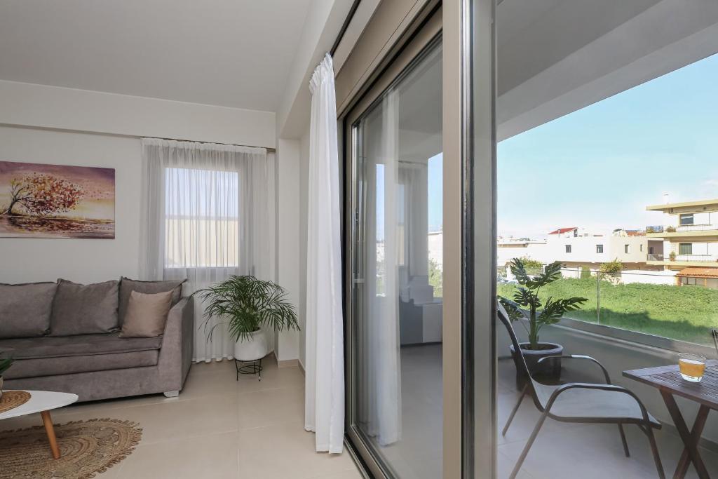 a living room with a couch and a table at Galanthus Apartment 2 in Chania