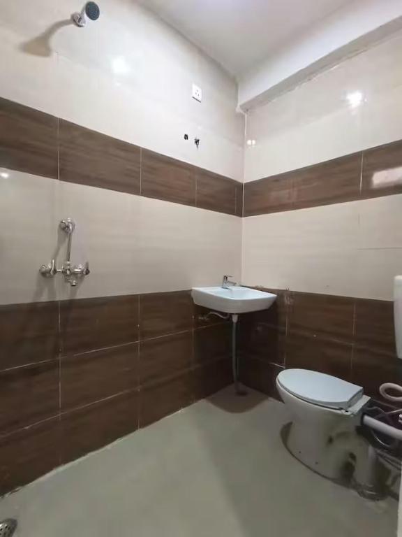 a bathroom with a toilet and a sink at 3bhk Villa WIth Terrace in Alwar