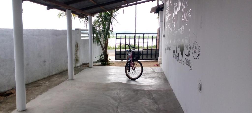 a bike parked in a room with a wall at The surf hostel in Panama
