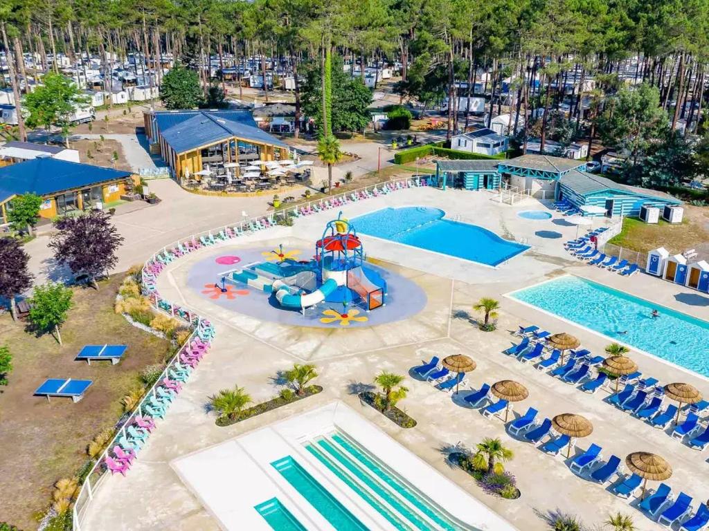 an overhead view of a pool at a resort at Les dunes de contis- landes in Saint-Julien-en-Born
