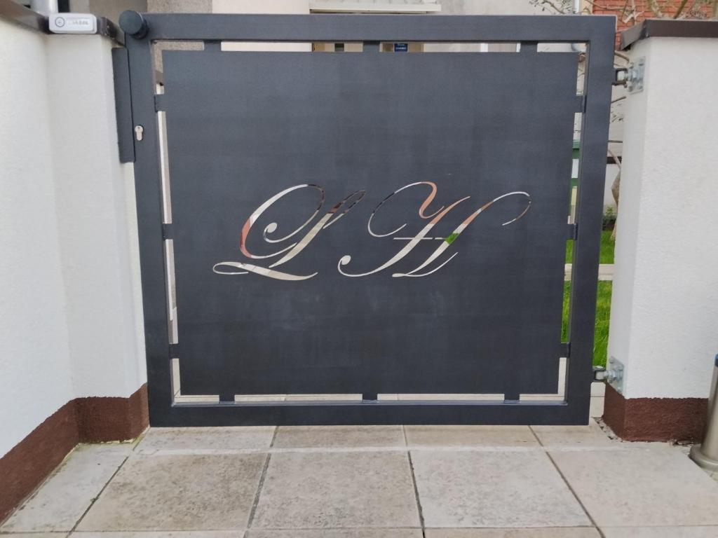 a garage door with the word of chef written on it at Lorber house Štinjan - Studio in Pula