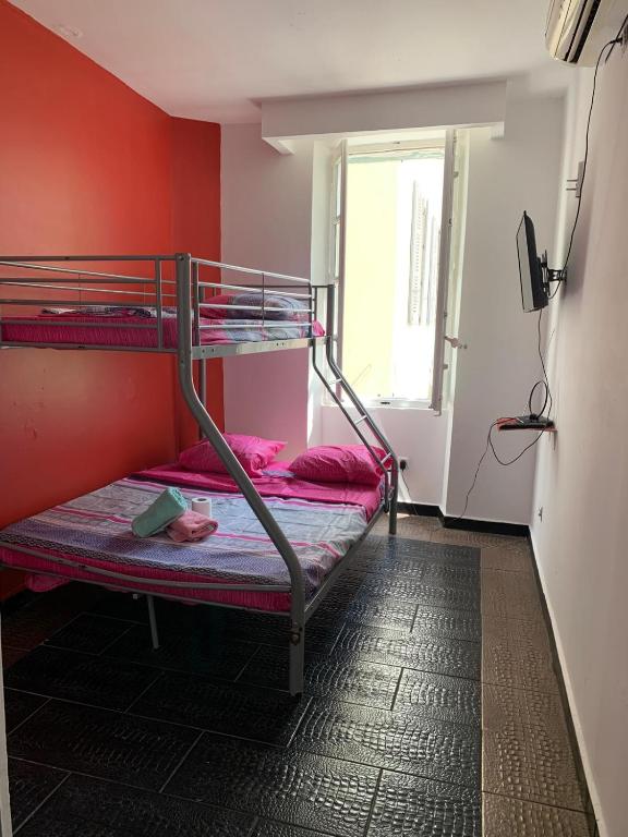 a room with two bunk beds and a window at capitol in Marseille