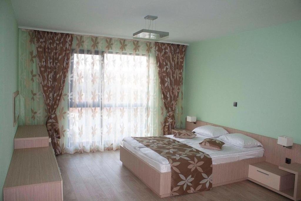 Postel nebo postele na pokoji v ubytování Iva Resort