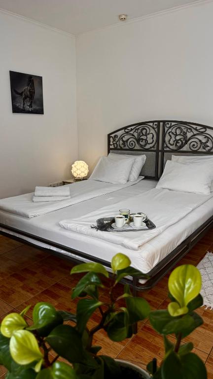 a bed with a plate of food on it at Гранд Хостел in Chernivtsi