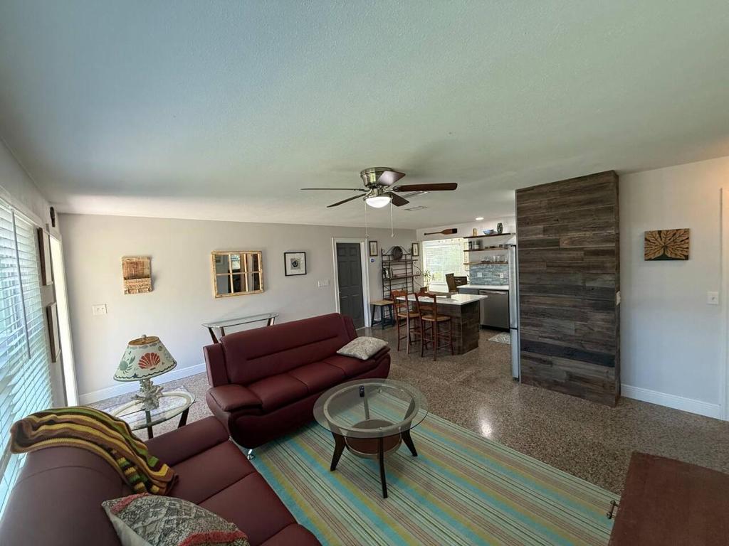 a living room with a couch and a table at 1008 Gardens in Vero Beach