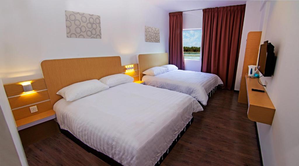 Postel nebo postele na pokoji v ubytování Thanks Hotel