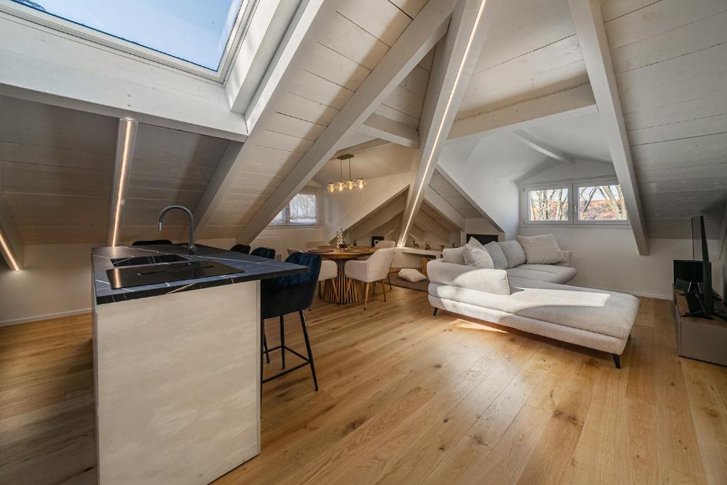 a kitchen and living room with an attic at Attico Mansardato con terrazzo privato in Monza