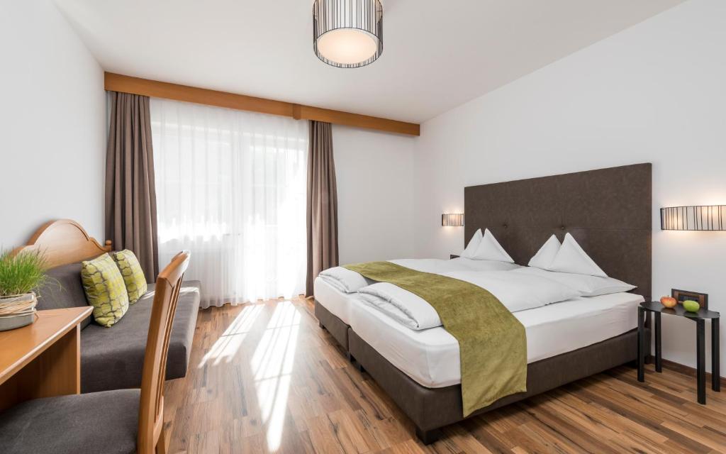 Postel nebo postele na pokoji v ubytování Vinschgerhof
