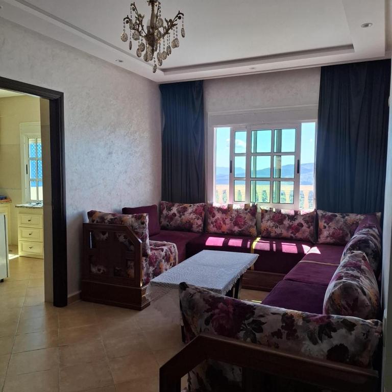 a living room with a couch and a table at Mina House in Chefchaouen