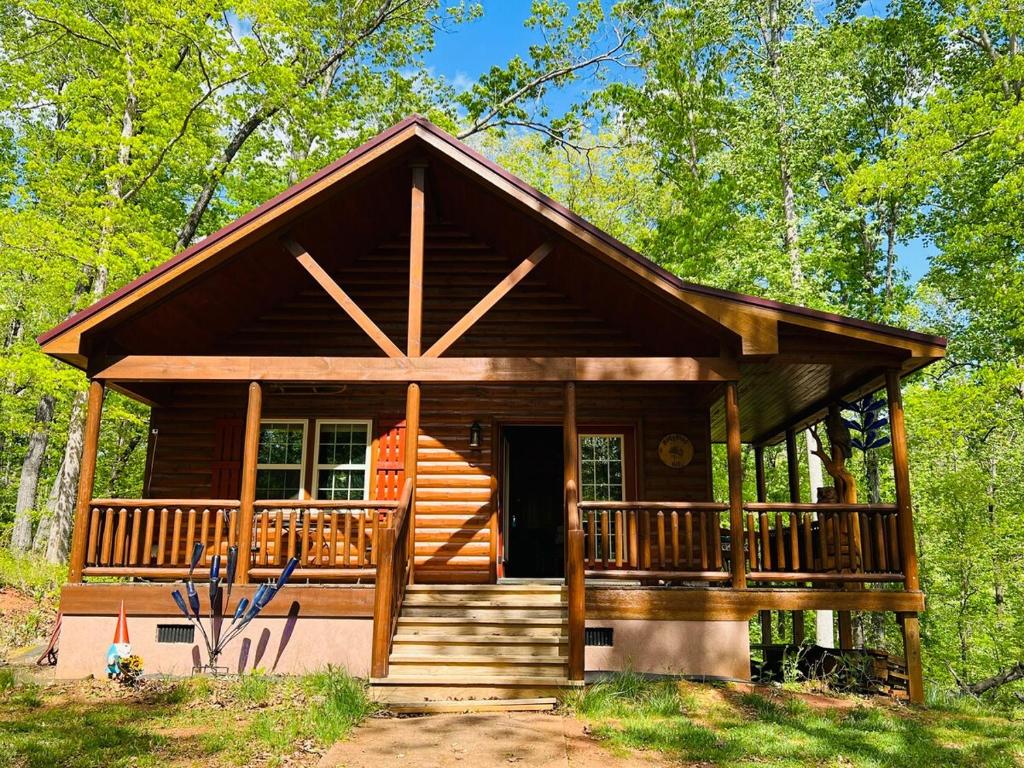 a cabin in the woods with a large deck at Hedgehog Hill Cabin-Helen Hideaway in Clarkesville