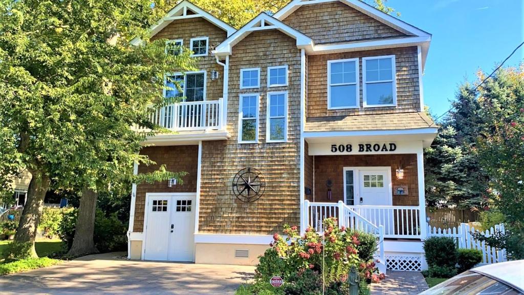 a house with a road sign on it at Seamans Folly On Broad in Cape May