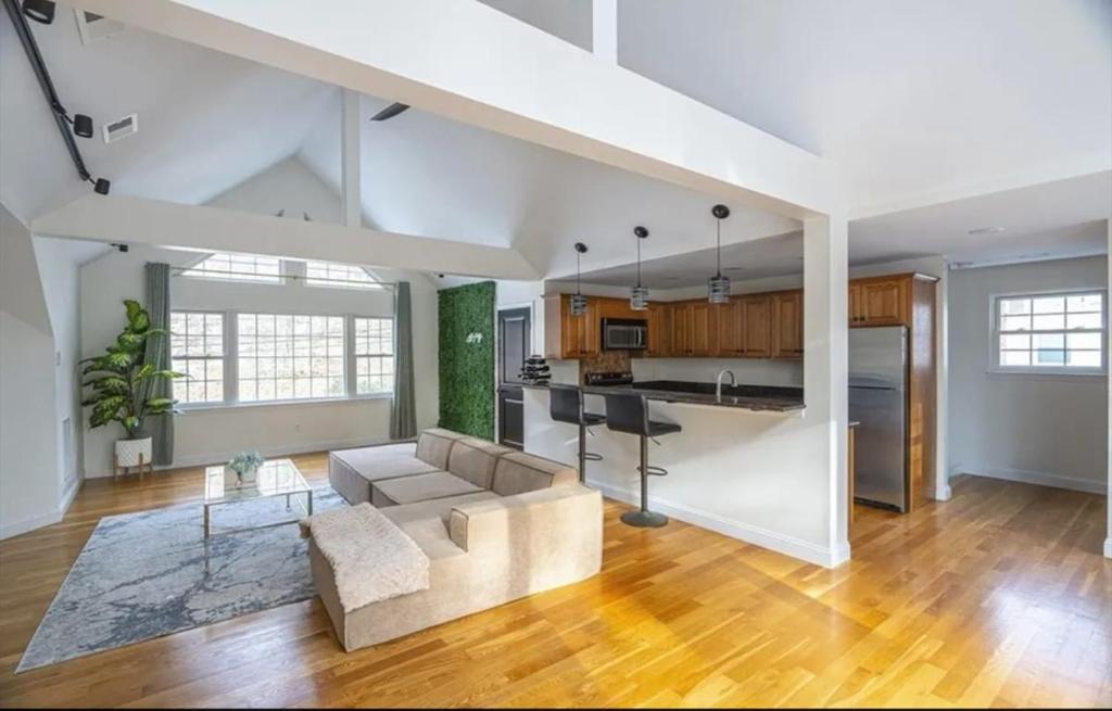 a large living room with a couch and a kitchen at GorgeousWestwood in Westwood