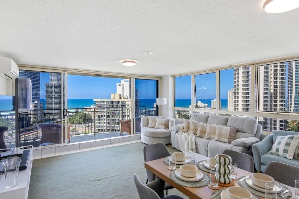 a living room with a couch and a table at Salt & Sky Arcade - Sleeps 12 in Gold Coast