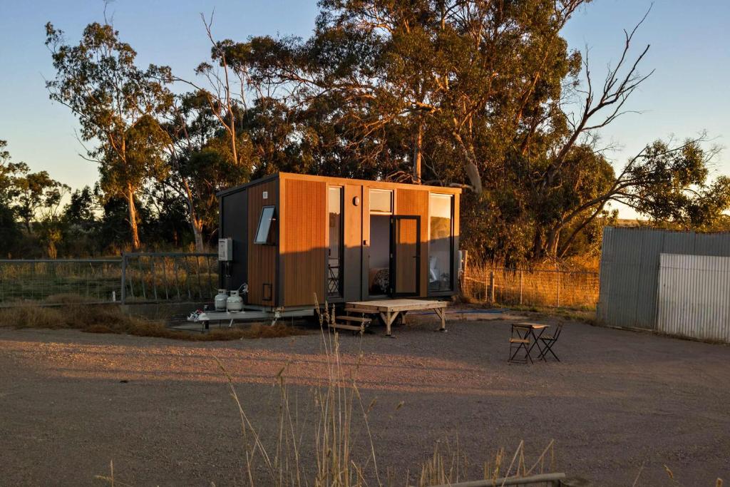 a tiny house sitting in a parking lot at Rivergum Lodge by Tiny Away in Scotts Creek