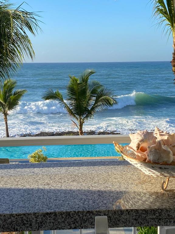 a view of the ocean from a resort at Apartamento Juan Dolio in Juan Dolio