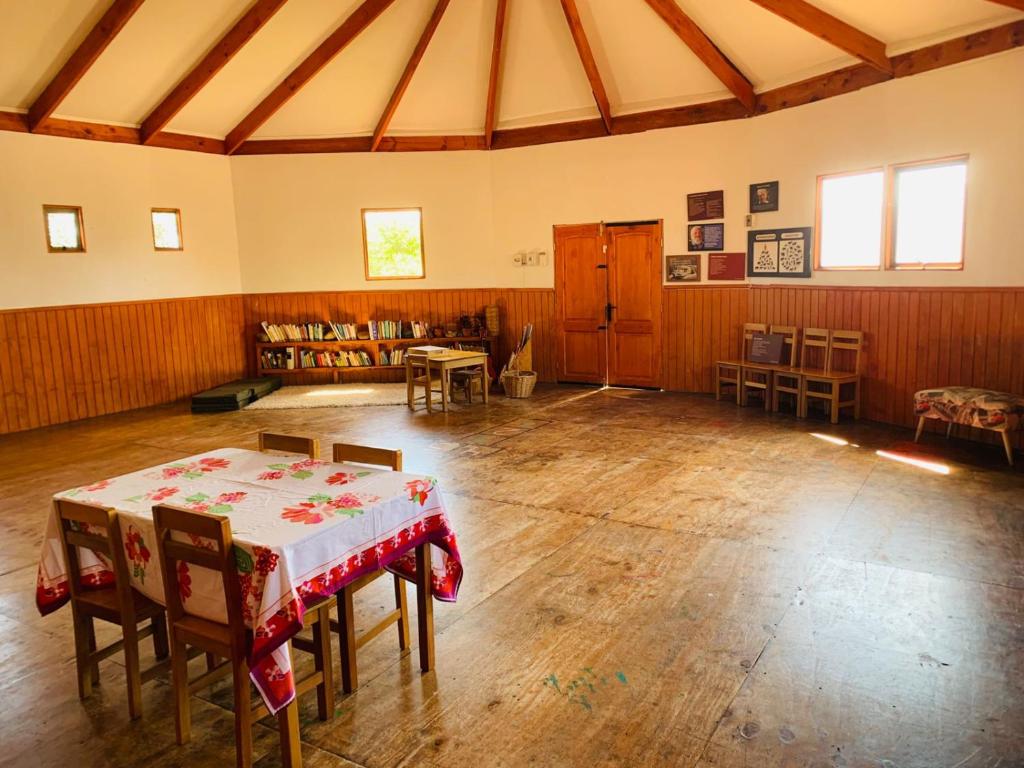 a large room with a table and chairs in it at Casa La Nuez in Algarrobito