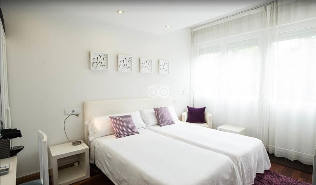 Postel nebo postele na pokoji v ubytování Hotel Itxas Gain Getaria