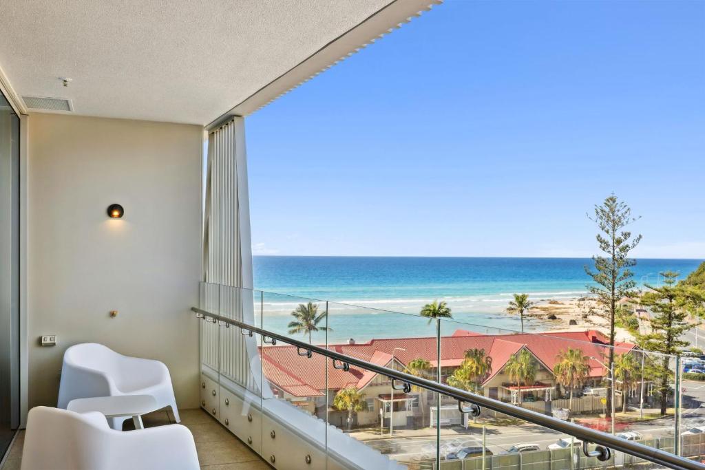 a balcony with a view of the ocean at Miles at Kirra Point 604 in Gold Coast