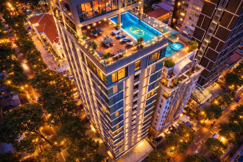 an overhead view of a tall building at night at Northern Charm Hotel in Ho Chi Minh City
