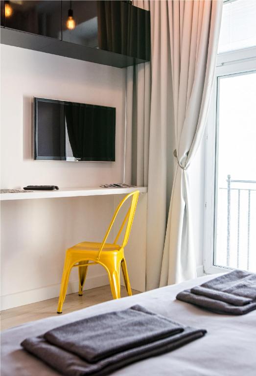 Televízia a/alebo spoločenská miestnosť v ubytovaní Marszałkowska Apartament 138