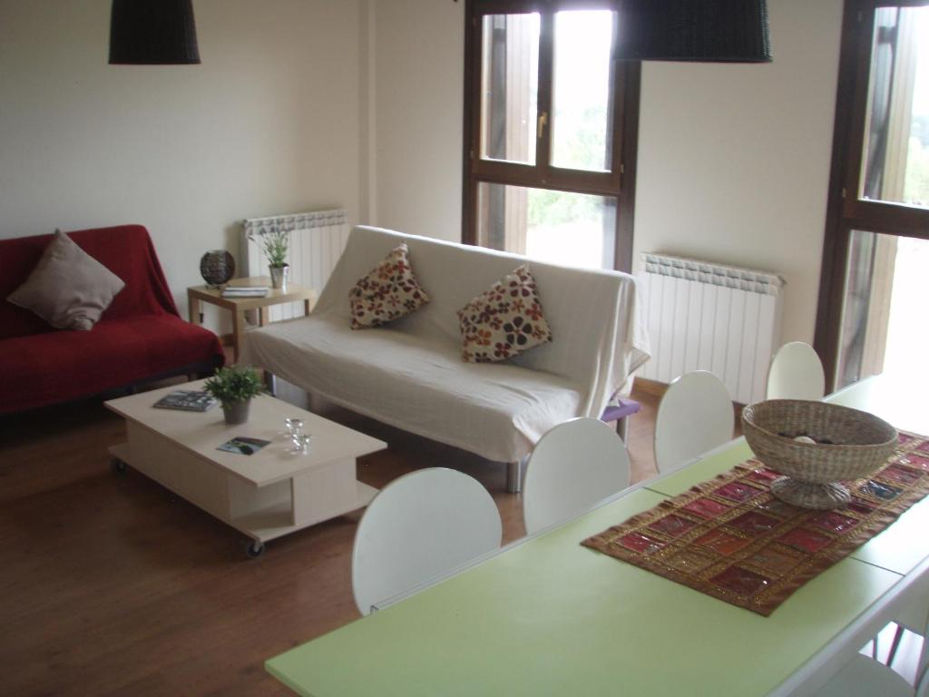 a living room with a couch and a table at Casa Mallos de Agüero in Agüero