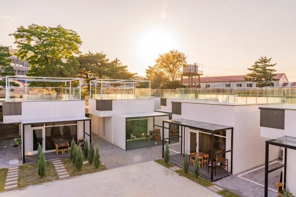 an architectural rendering of a house with glass at Pool Lounge Pension & Glamping in Yangyang