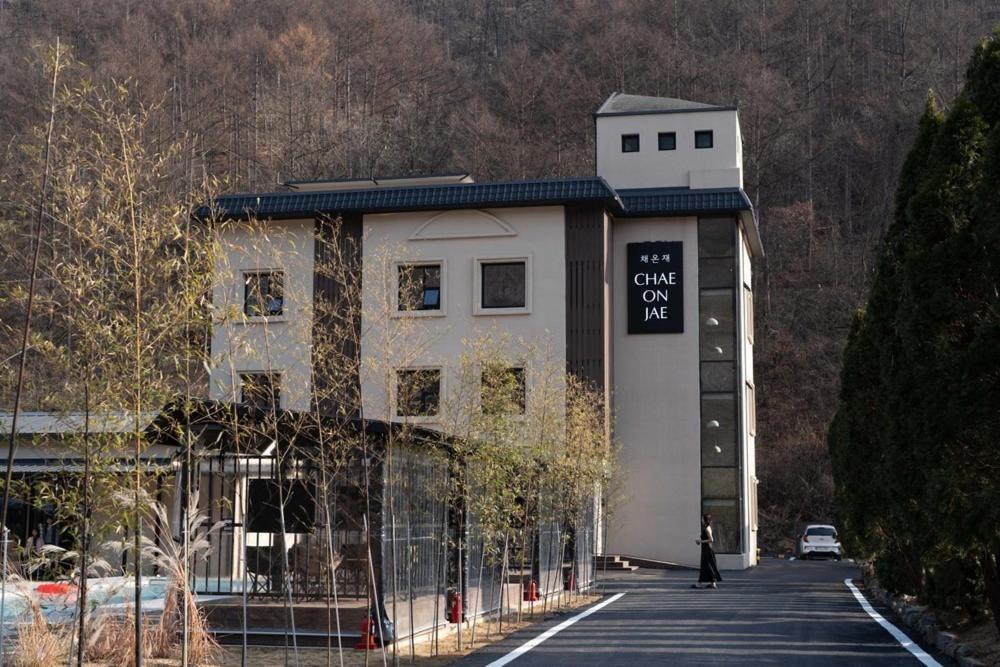 a building with a sign on the side of it at Chaeonjae Gongju in Gongju
