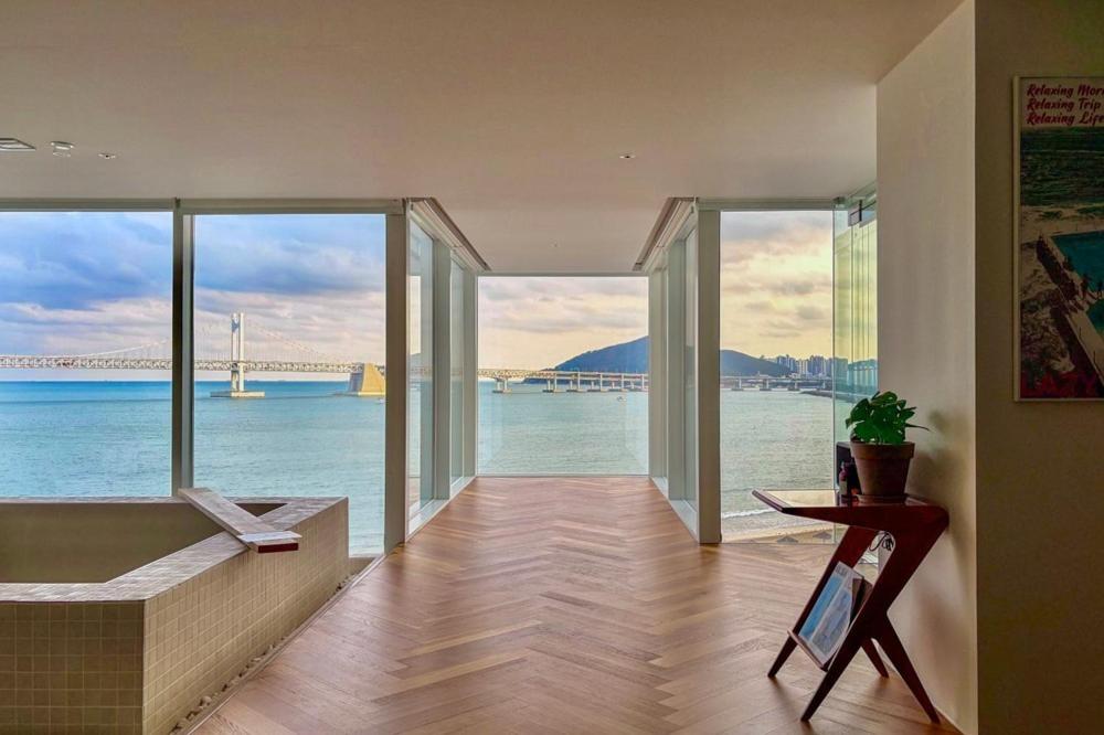 a living room with a view of the water at Busan Neouigyejeol in Busan