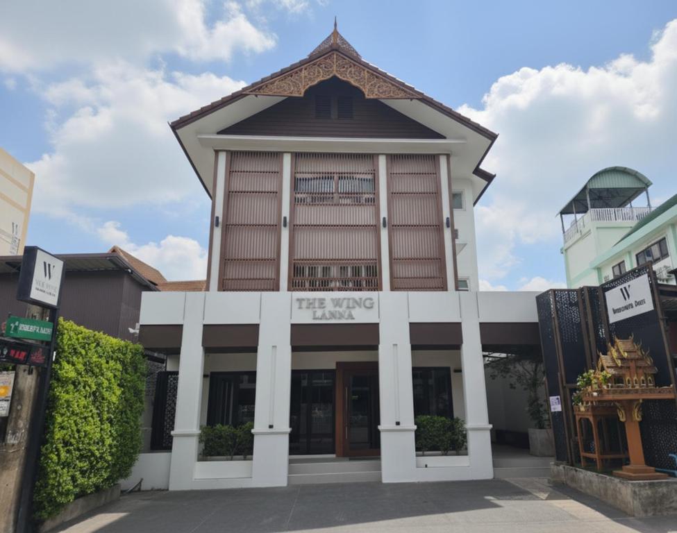 a building with a sign that reads trading hall at The Wing Lanna Hotel in Chiang Mai