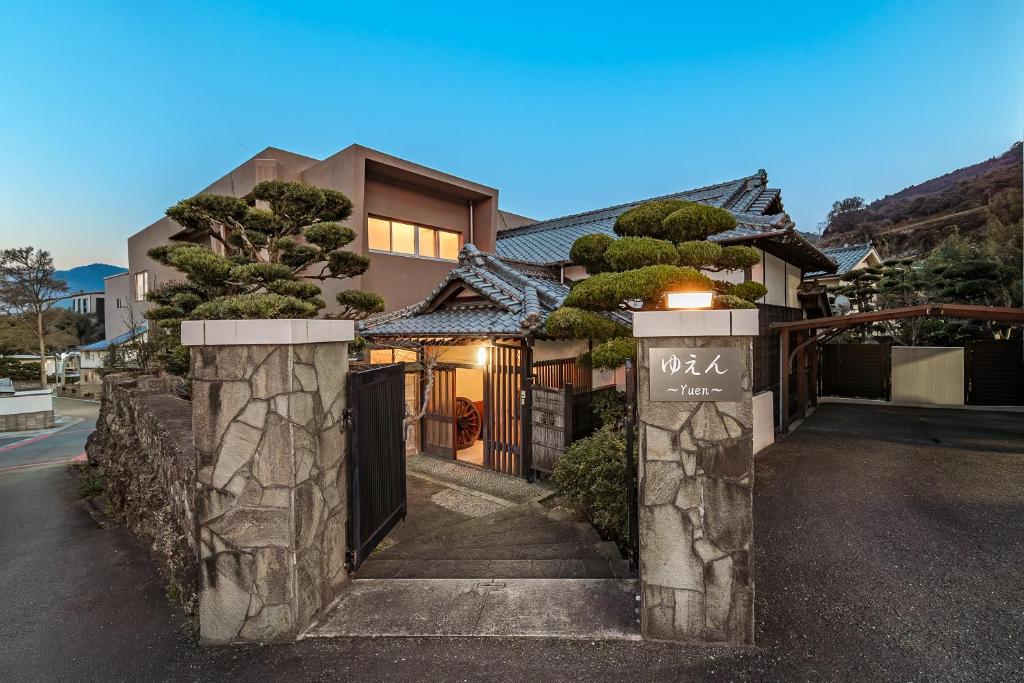 a house with a gate in front of it at Yuen in Beppu