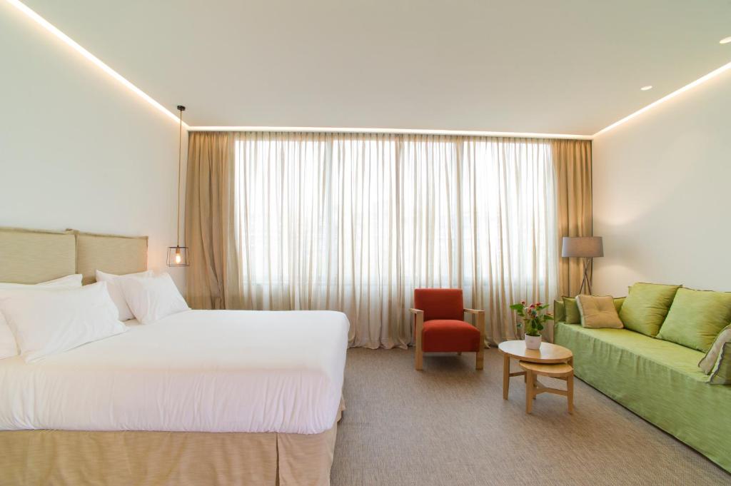 Posteľ alebo postele v izbe v ubytovaní NLH FIX | Neighborhood Lifestyle Hotels