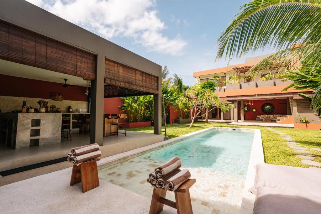 an image of a house with a swimming pool at Lasai Villas in Gili Islands