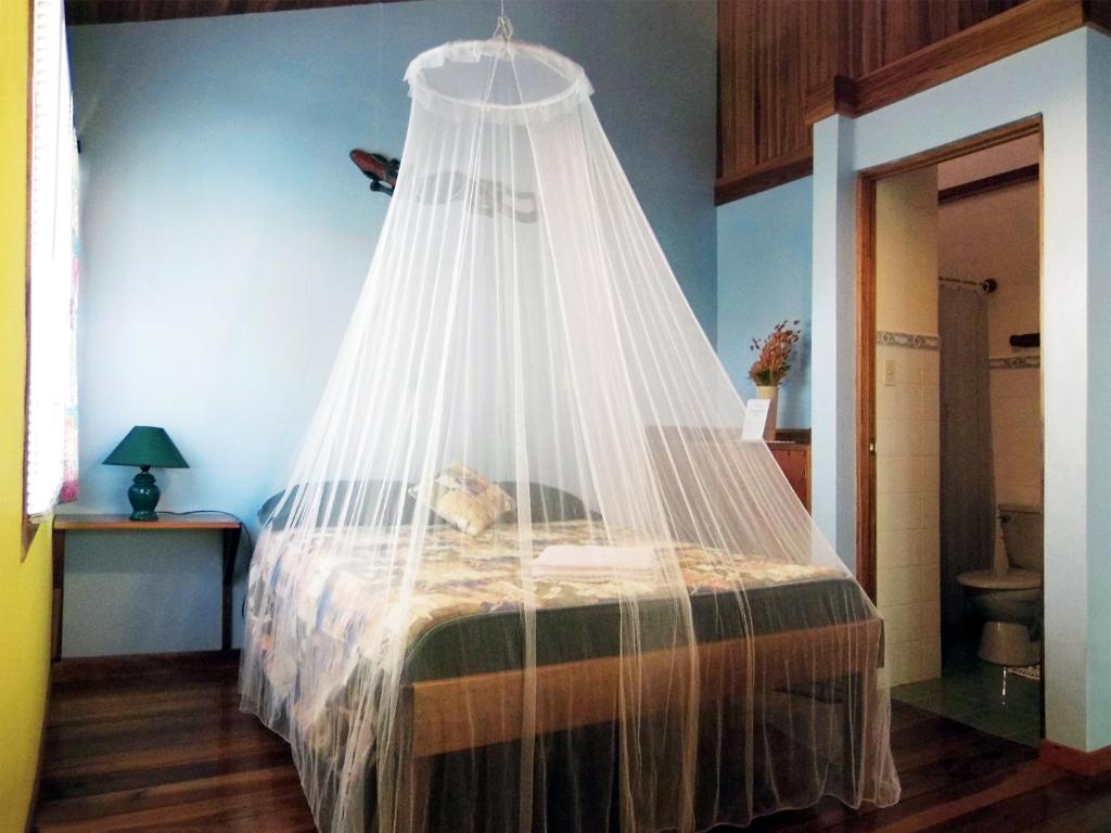 Postel nebo postele na pokoji v ubytování El Colibri Lodge
