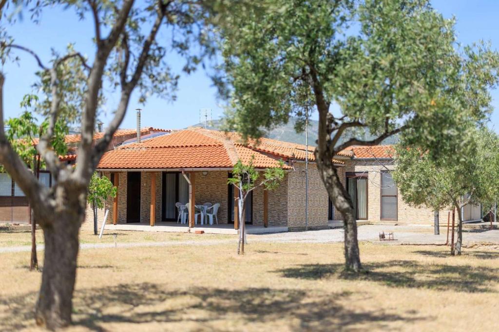 a house with an orange roof and some trees at Natural retreat in Makri