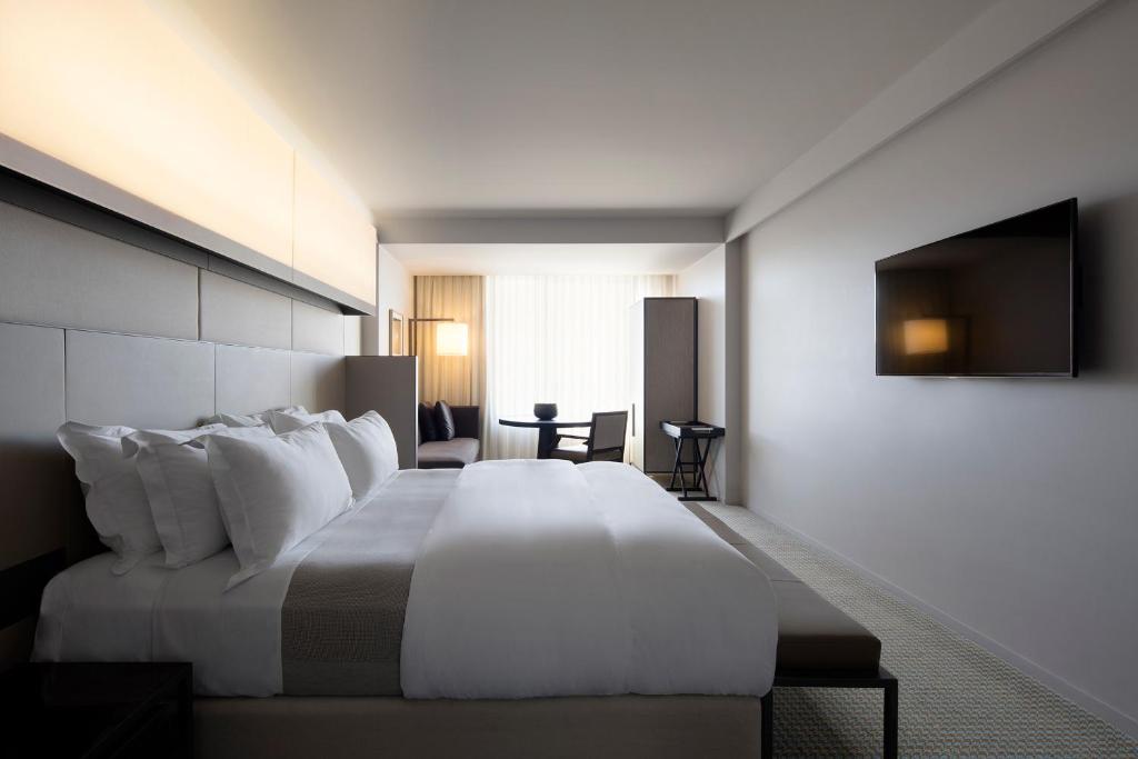 Postel nebo postele na pokoji v ubytování Hotel Realm