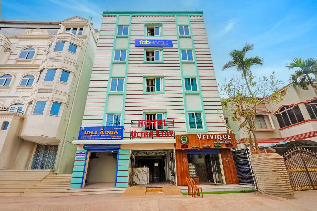 a tall building with a sign on top of it at FabHotel Ultra Stay in Bhubaneshwar